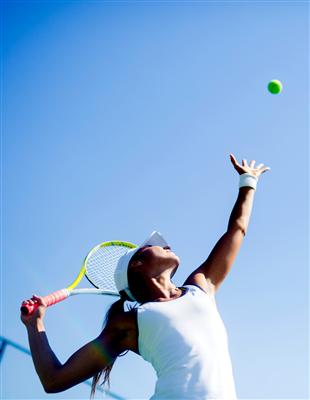 tennis pro serving the ball