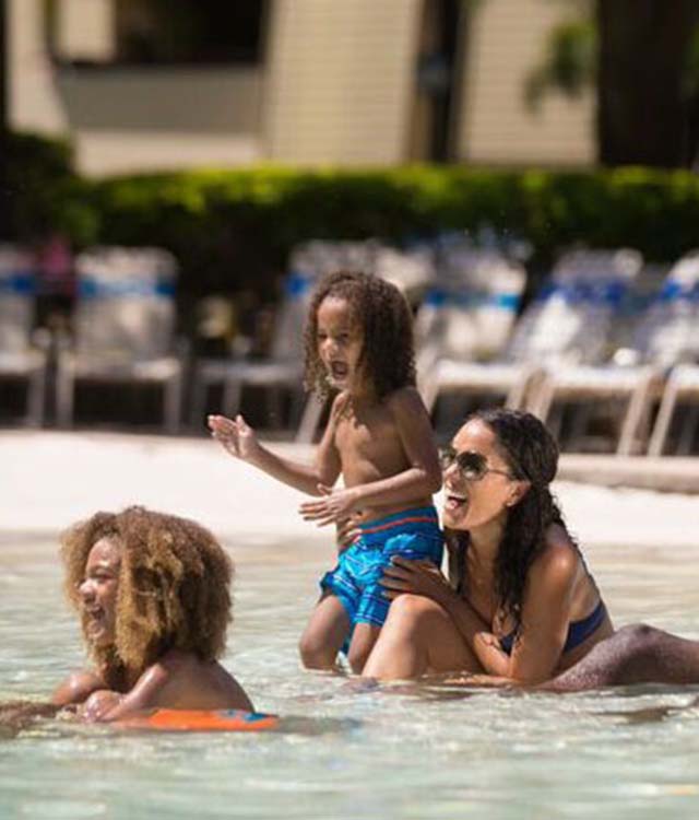 A family having fun in the pool