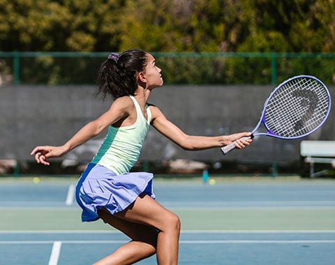A girl playing tennis