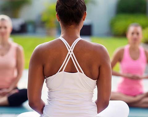 Three woman doing yoga