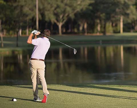 A man playing golf