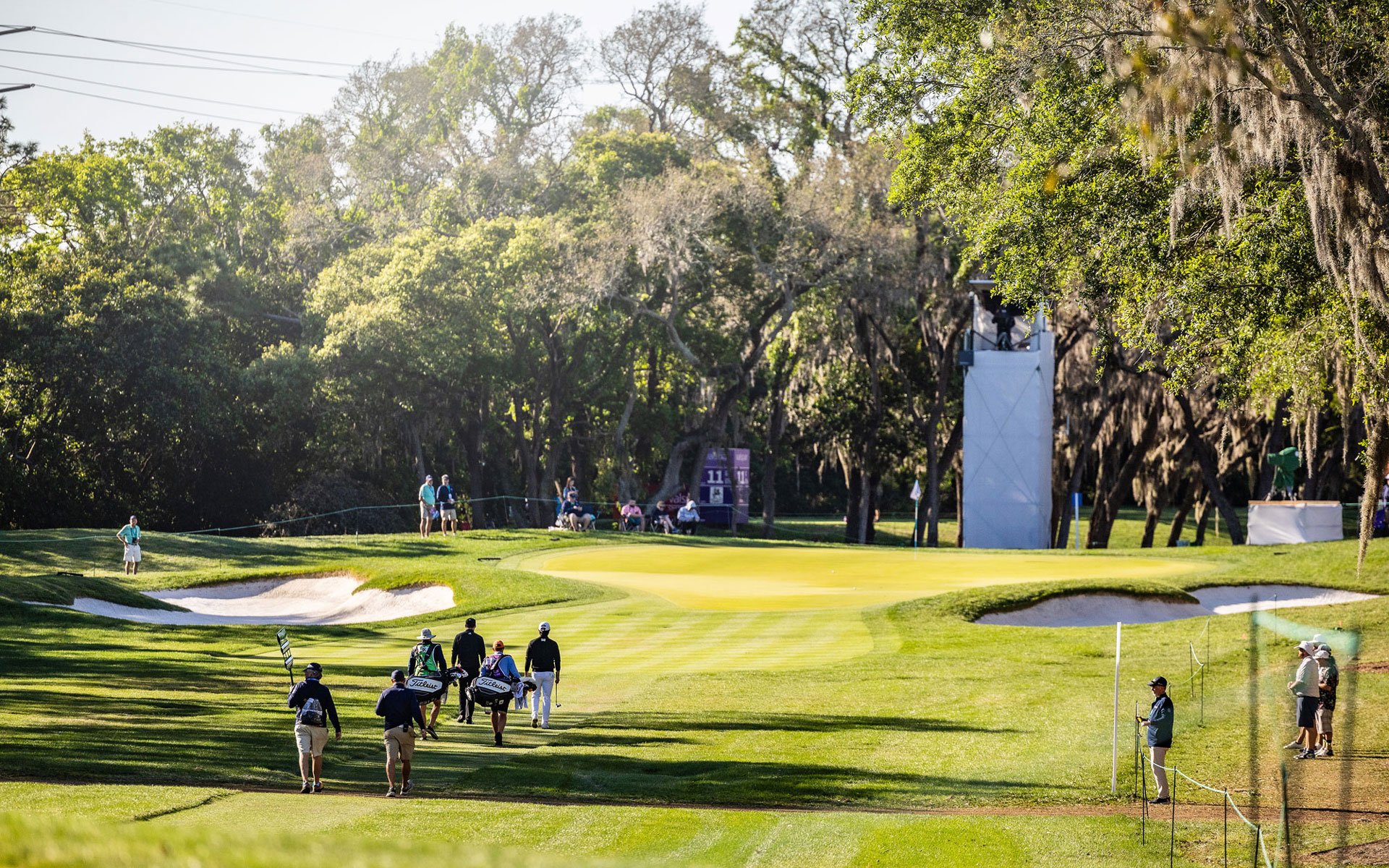 A golf course as the sun is setting
