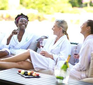 Three woman lounging in robes