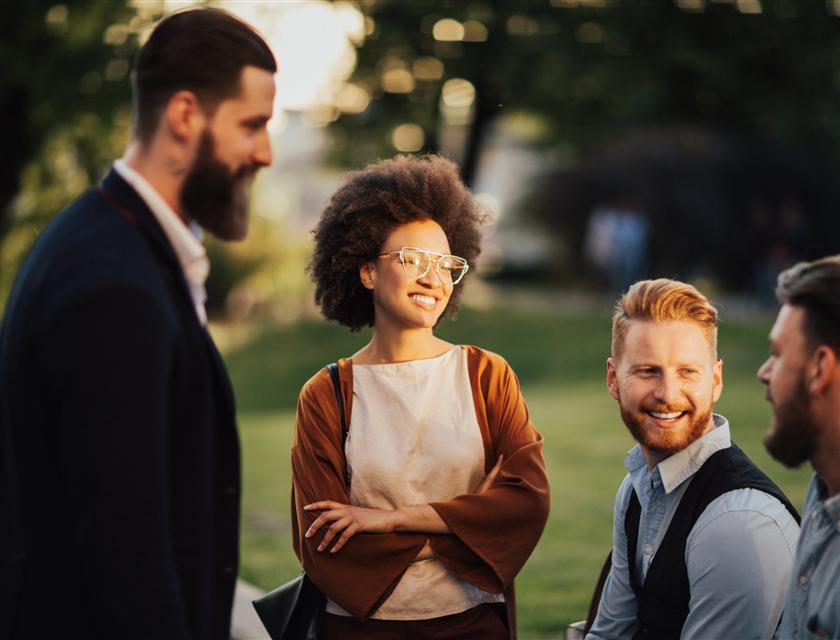 A group of people meeting and smiling