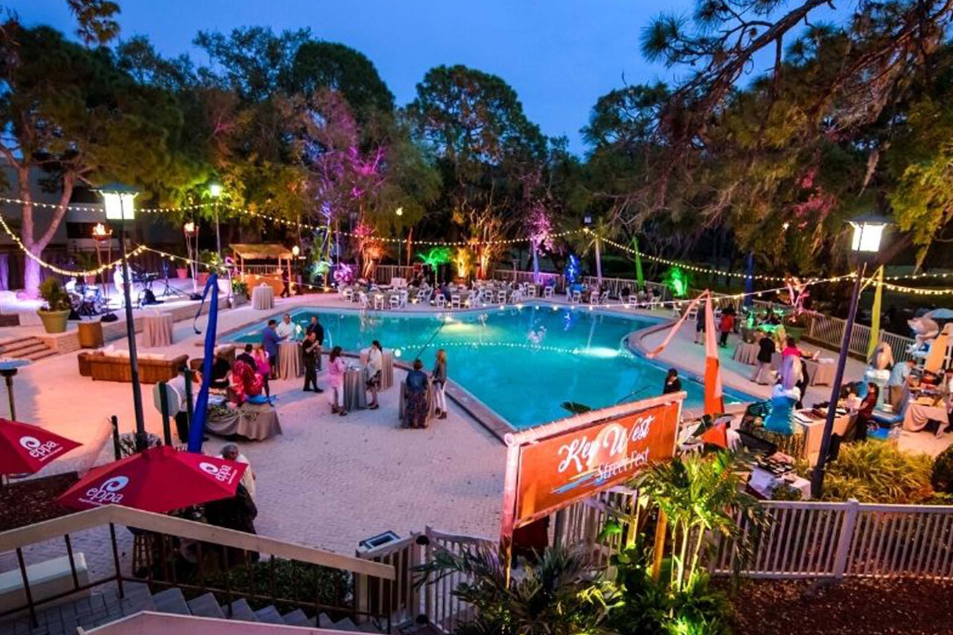 A pool at night with colorful lights