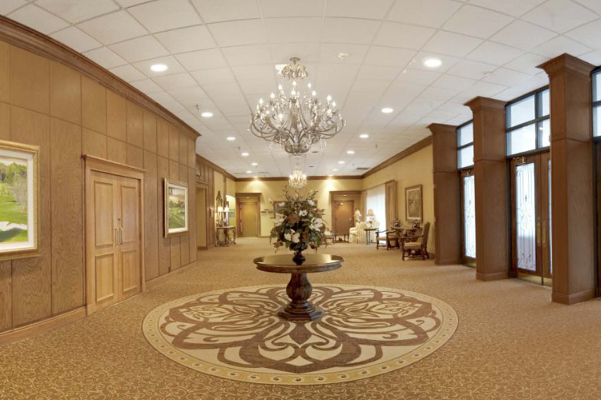 A long corridor with a chandelier 