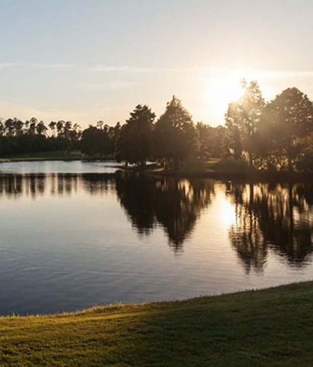 The sun reflecting off a lake