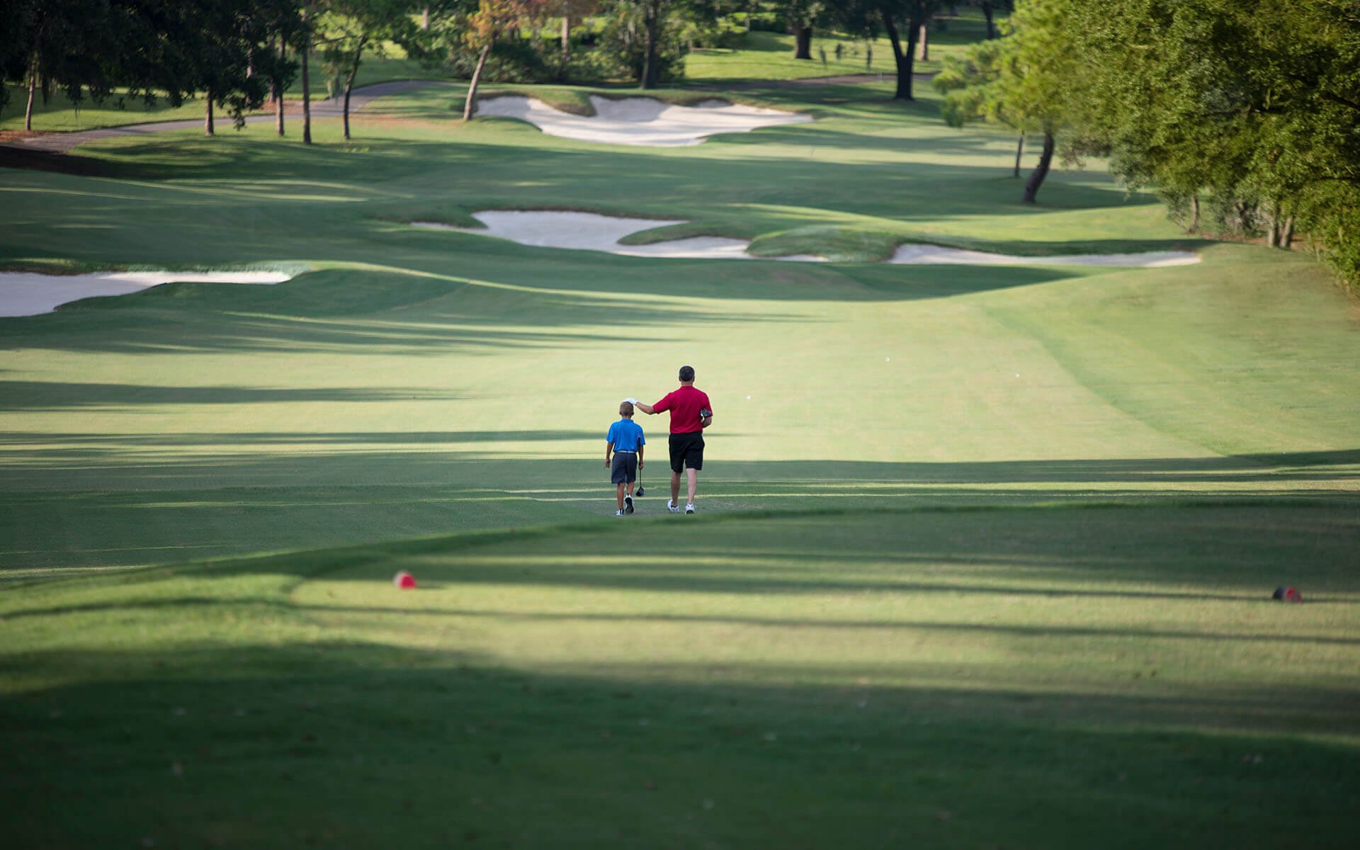 A father and son on the golf course