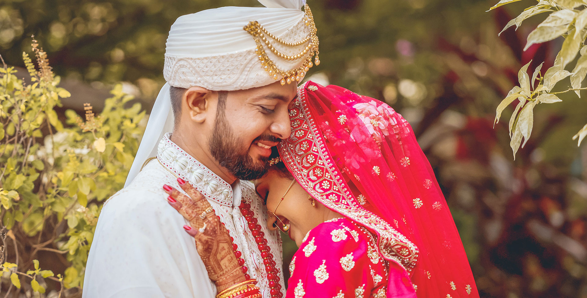 A man and woman embracing one another smiling