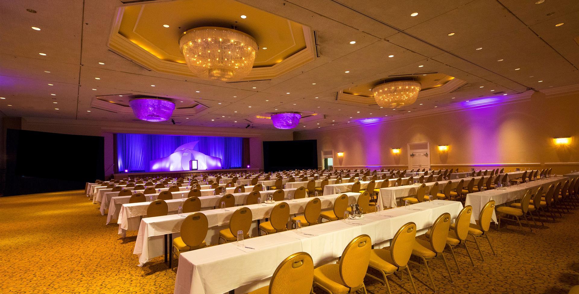 A big hall filled with chairs and a stage