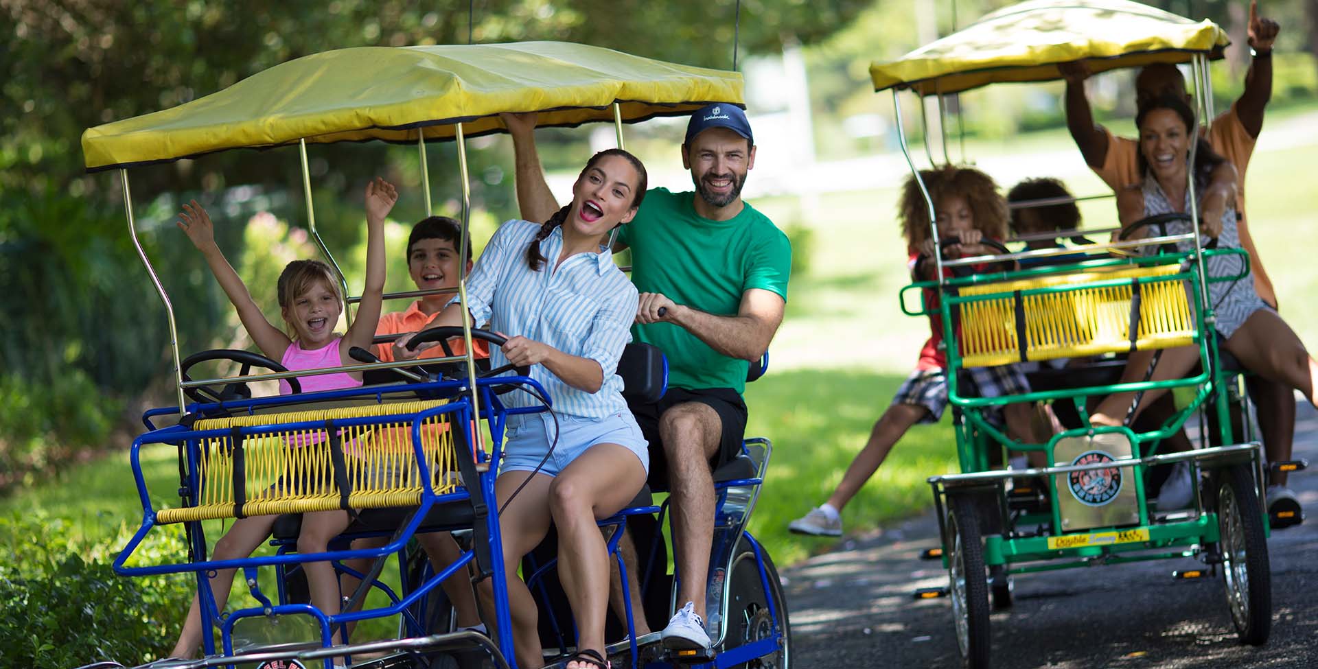 Families riding a four-wheel bikes