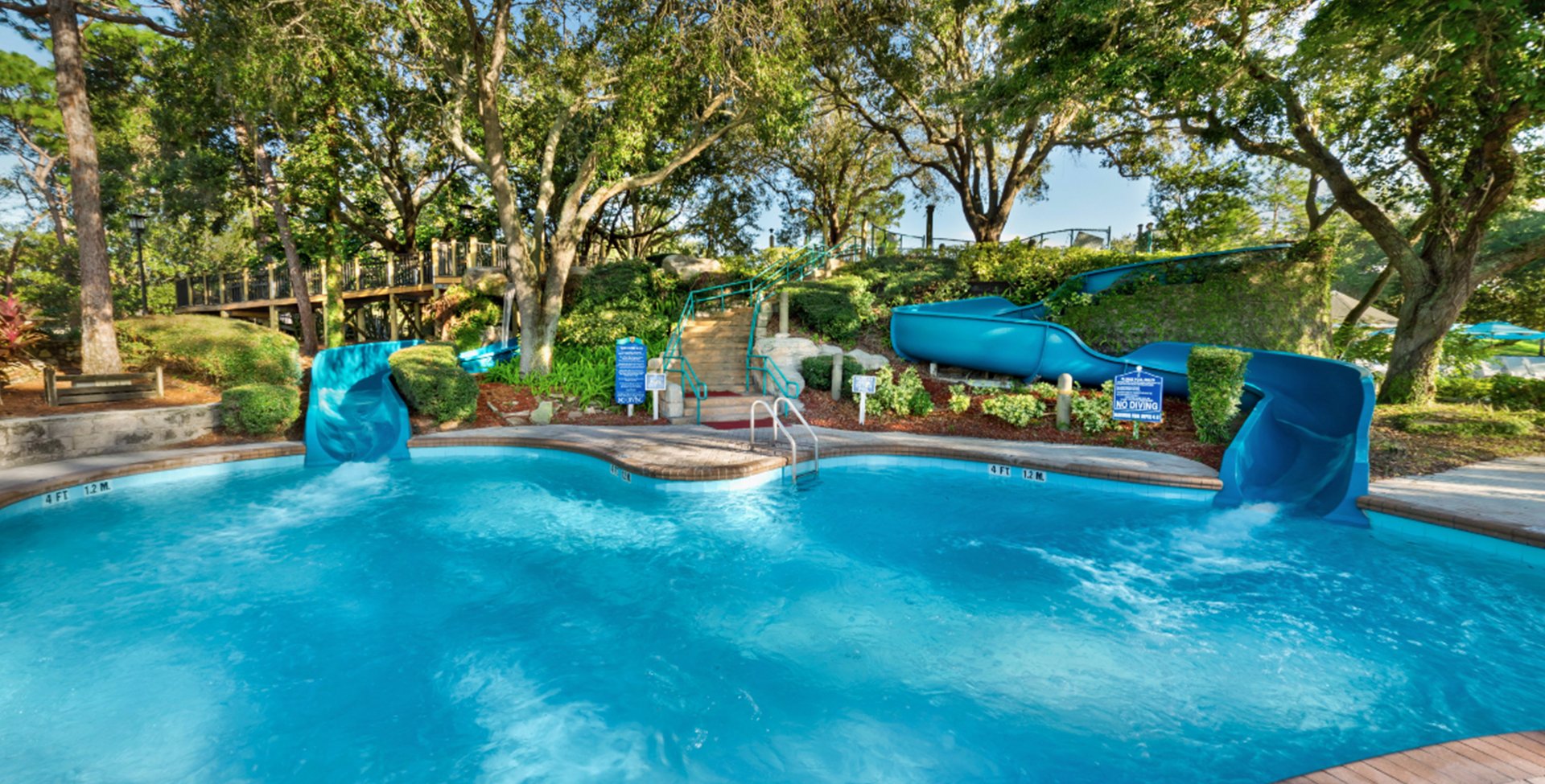 two waterslides and a pool