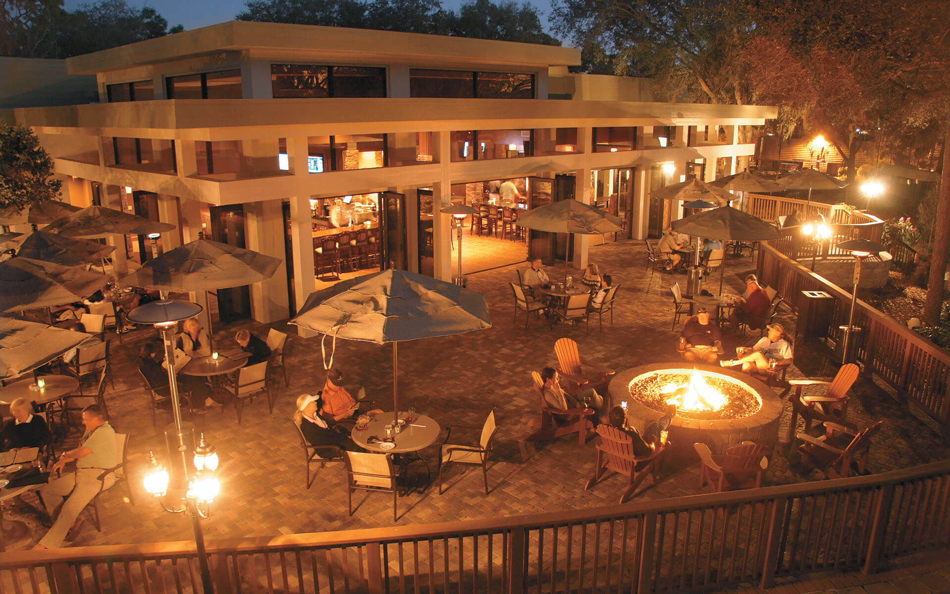 A large outdoor restaurant space with a fireplace