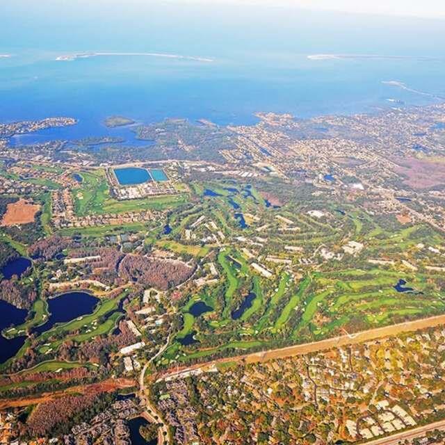 aerial view of golf course and resort