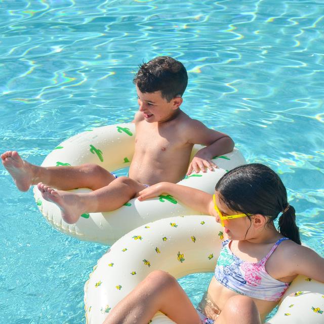 kids floating in pool